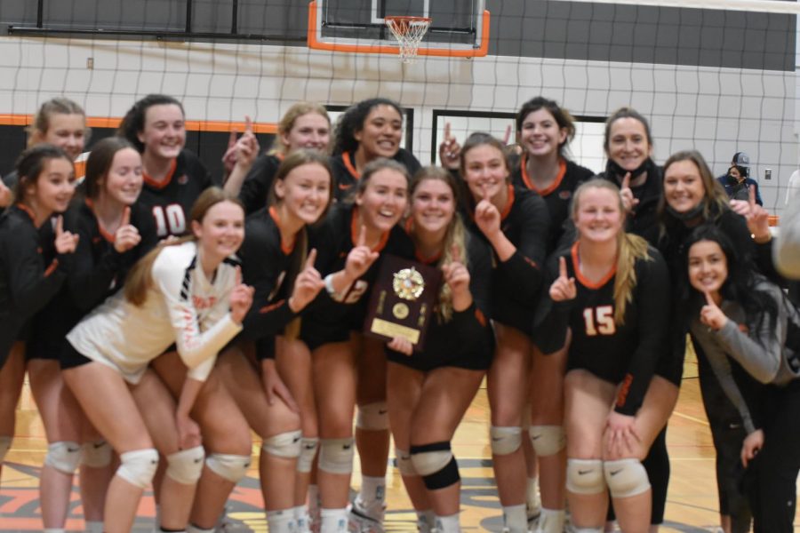 The 2021 Ephrata Tiger volleyball team poses with their new hardware, the district championship trophy.  This is the Tigers first district volleyball title since 1989.  They will make their first appearance at state in 10 years when the Tigers face off against the Anacortes Seahawks on Friday, November 19th.