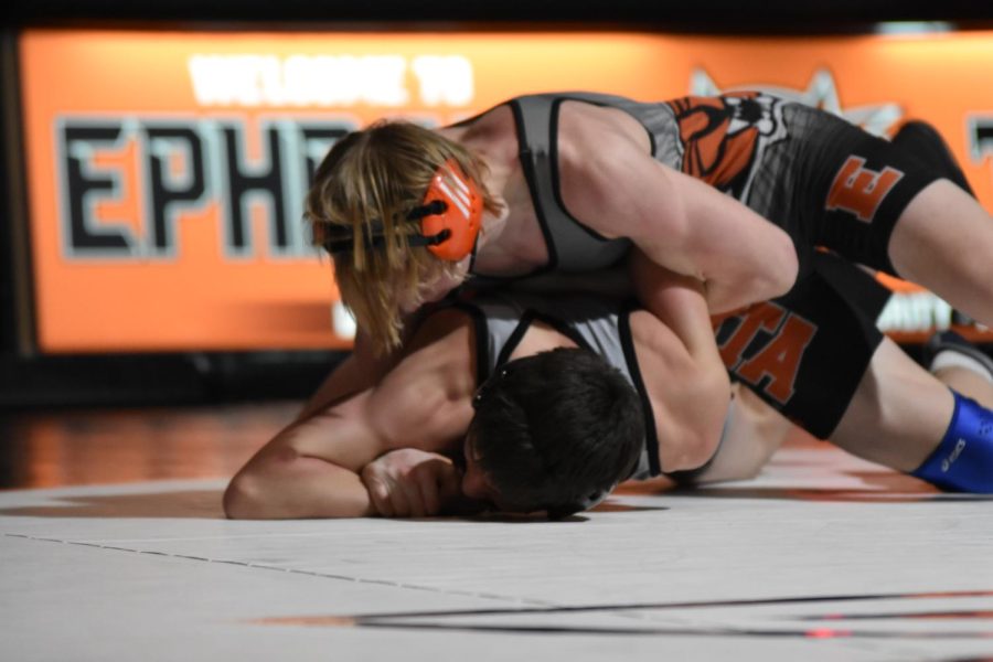 Junior Hudson Sager takes down his opponent during the meet with Grandview on January 20th.