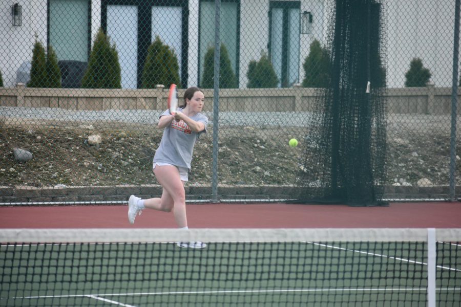 Lexie Diem (11) hits the backhand shot versus her opponent on Friday in Chelan (March 18, 2022).