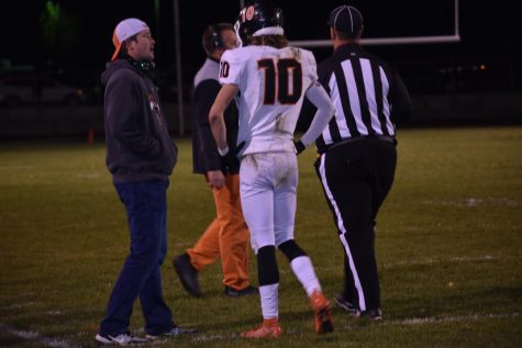 Tiger defensive coordinator, Patrick Mitchell, talks with senior Beau Dechenne during a game at Prosser this past season.  Mitchell was recently named the new head coach of Tiger football.