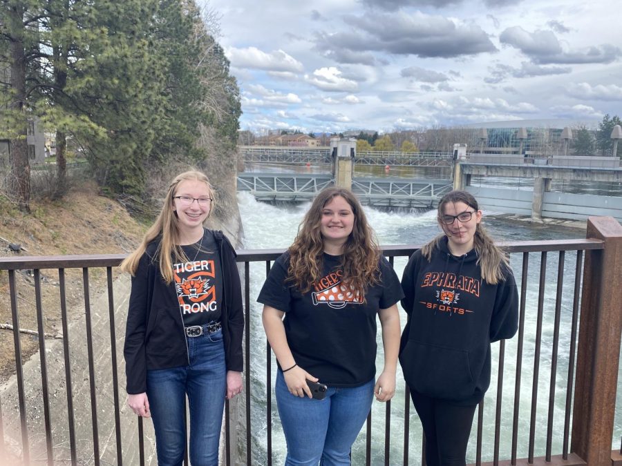 With Spokane Falls in the background, FBLA state conference attendees Baylie Broesch, Tiffany Alexander and Jessica Mathis are prepared to put their skills to the test this week in Spokane at the State Leadership Conference. (April 20, 2022)