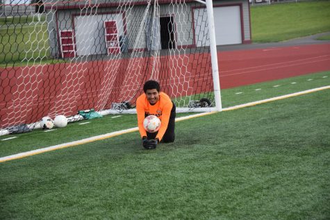 Noe Rodriguez Acevedo (12) has been the man in goal for the Tigers all season.  He was all smiles during warmups for the Grandview match last night. (April 28, 2022)