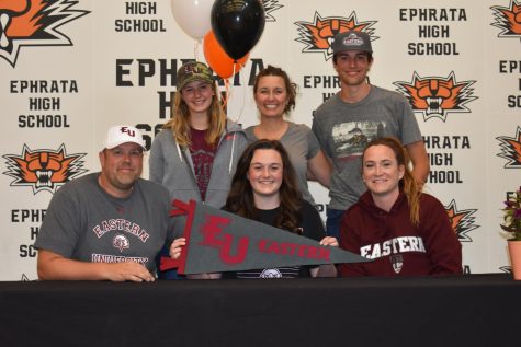 Lindsay Addink (center), a senior setter for Ephrata, has commmitted to play volleyball for Eastern University in Pennsylvania.  Pictured are Ben Addink, Sienna Addink, Jada Addink, Lindsay (holding pennant), Chase Addink and Coach Britney MacLeod