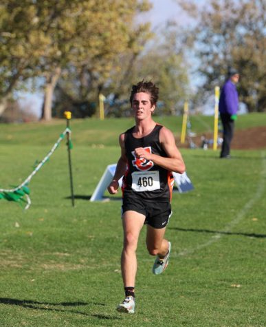 Hayden Roberts, junior, pushes along the course at Sun Willows in Pasco during the state cross country meet on Saturday, November 5th.  Roberts would end finish in 10th place.
