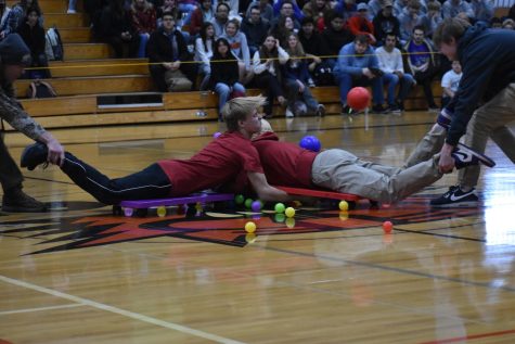 Walker Fulk (11) and Kyler Black (12) crash during a friendly game of Hungry Hippo. Fridays assembly was to celebrate the kick off to winter sports at Ephrata High School. 
