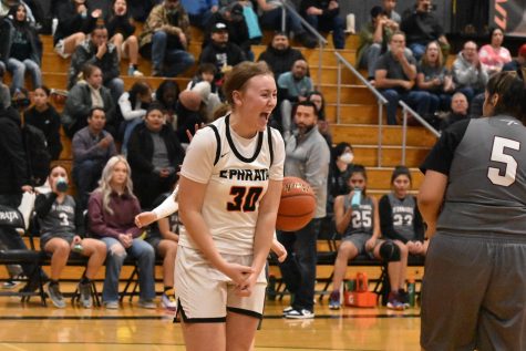 Addison Mills (11) lets out a scream following a basket against Wahluke on Friday night.  Mills made the basket and was fouled in the process resulting in an and one opportunity.  The Tigers defeated the Warriors 67-23.