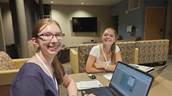 Baylie Broesch (11) and Makaena Judkins (11) spend time planning the upcoming yearbook during an evening work session at the Inland Northwest Yearbook Camp in Cheney, WA this summer. 
