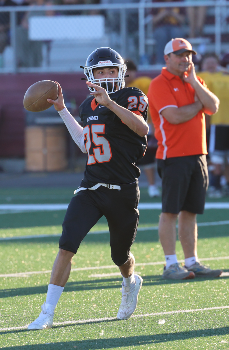 Cooper Vasquez (9) looks to complete a pass during a C squad jamboree Friday, August 30th at Moses Lake's Lions Field. Coach David Laird looks on during the offensive series by the Tigers.  The Tigers varsity and junior varsity teams were also in action during the jamboree, which included Moses Lake High School and Royal High School.  The Tigers open the regular season at home vs. Prosser on September 6th.